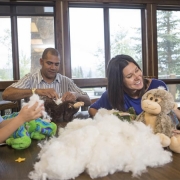 Family making stuffed animals